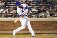 New York Mets' Javier Baez hits a two-run home run in the sixth inning of the baseball game against the Cincinnati Reds, Saturday, July 31, 2021, in New York. (AP Photo/Mary Altaffer)