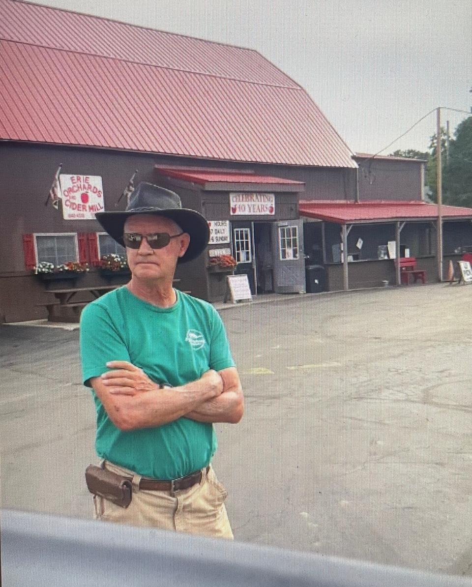 Steve Elzinga, owner of Erie Orchards and Cider Mill in Erie, Michigan, on August 13, 2023, standing near truck of Yousef Abu Jenna Mahmoud, of Ann Arbor. Mahmoud shared a video of Elzinga in which he is heard saying: "Every Muslim that comes in here steals from me."