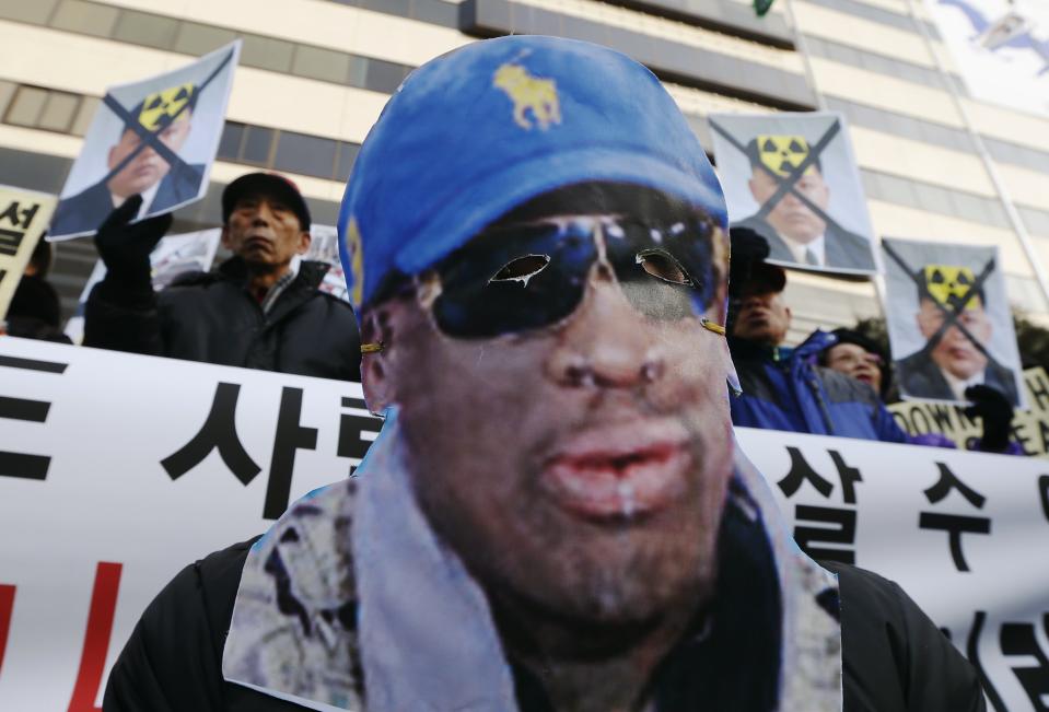 A protester attends a rally denouncing Rodman's visit to North Korea and North Korean leader Kim Jong Un on Kim's birthday in central Seoul