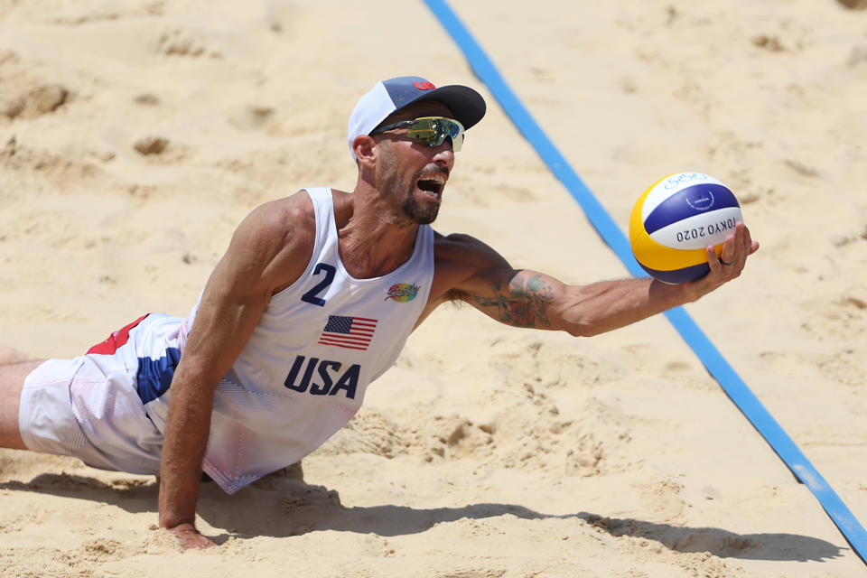 <p>TOKYO, JAPAN - JULY 29: Nicholas Lucena #2 of Team United States dives for the ball against Team Argentina during the Men's Preliminary - Pool D beach volleyball on day six of the Tokyo 2020 Olympic Games at Shiokaze Park on July 29, 2021 in Tokyo, Japan. (Photo by Sean M. Haffey/Getty Images)</p> 