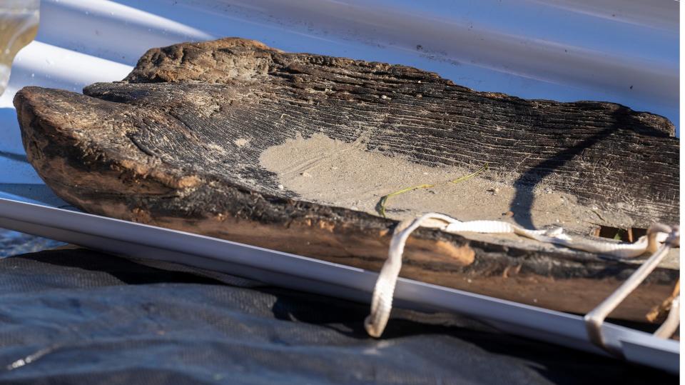 A just-recovered a 3,000-year-old dugout canoe is shown Thursday, September 22, 2022 from Lake Mendota in Madison, Wis.