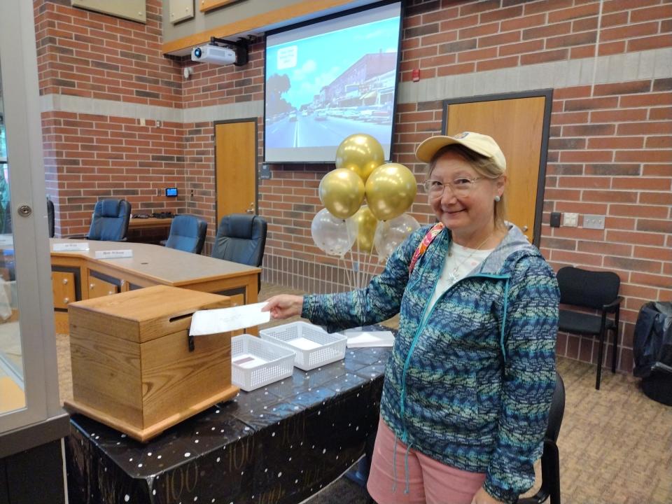 Janet Patterson of Gaylord submits her letter to the time capsule that was part of the Gaylord centennial on Aug. 13. The capsule will be unsealed in 2072.