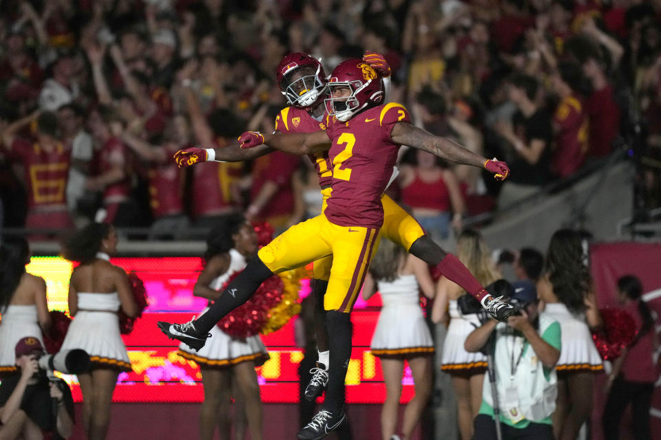 Sept. 9, 2023; Los Angeles, California; Southern California Trojans wide receiver Brenden Rice (2) celebrates with wide receiver Tahj Washington (16) after scoring on a 75-yard touchdown reception against the <a class="link " href="https://sports.yahoo.com/ncaaw/teams/stanford/" data-i13n="sec:content-canvas;subsec:anchor_text;elm:context_link" data-ylk="slk:Stanford Cardinal;sec:content-canvas;subsec:anchor_text;elm:context_link;itc:0">Stanford Cardinal</a> in the first half at United Airlines Field at Los Angeles Memorial Coliseum. Kirby Lee-USA TODAY Sports