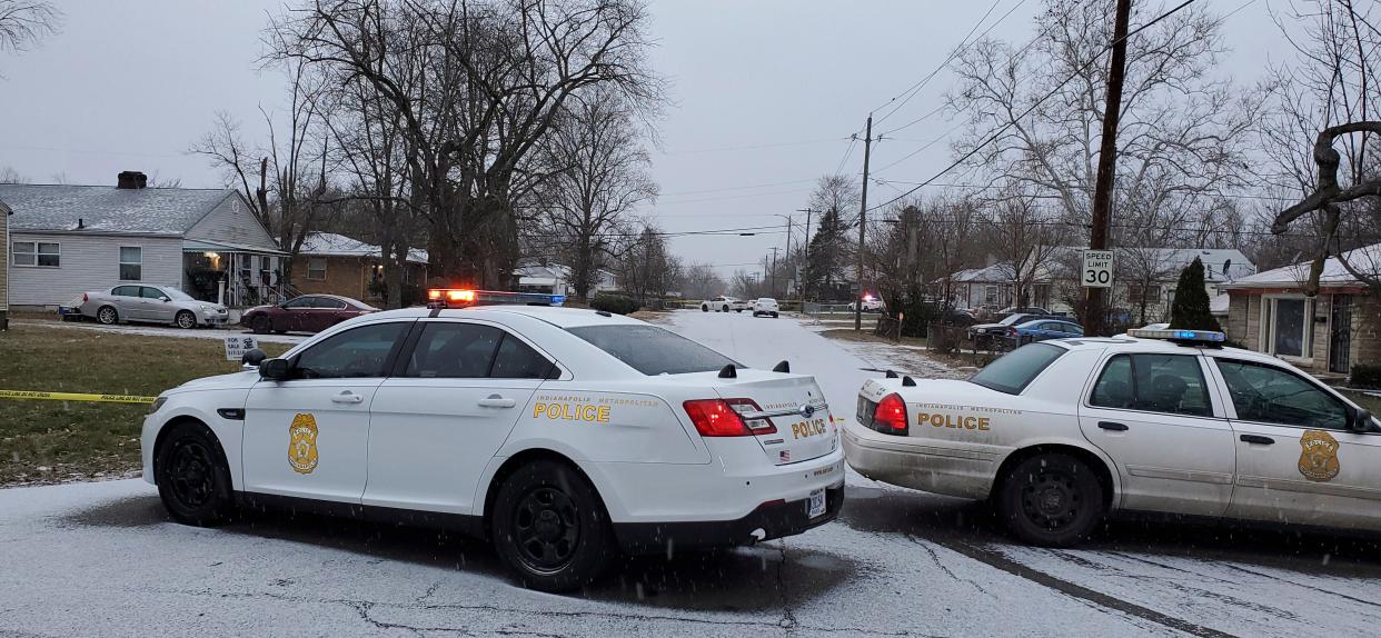 <p>Indianapolis Metropolitan Police Department at the scene on Sunday where five people, including a pregnant woman, were shot dead</p> (AP)