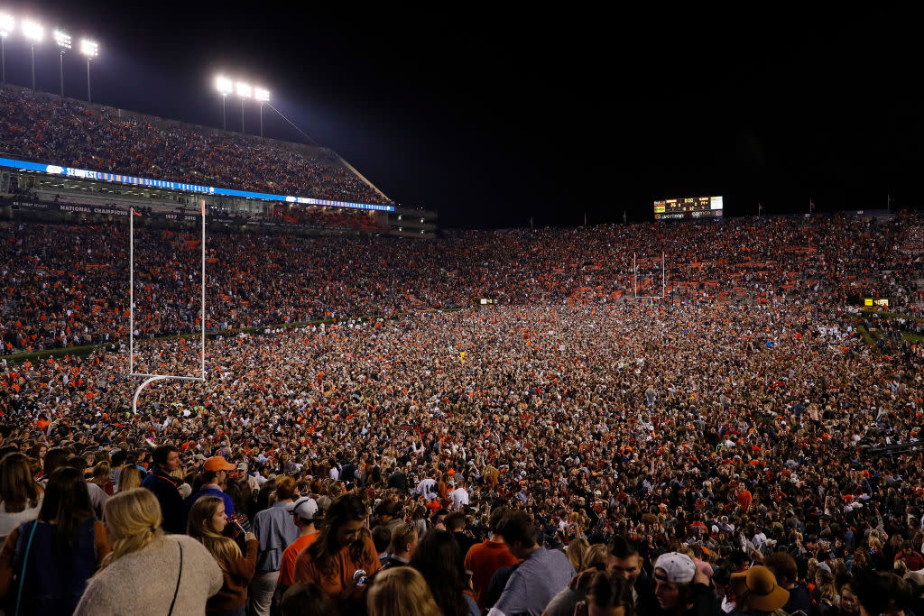 Fans swarm the field after the Iron Bowl. (Getty)