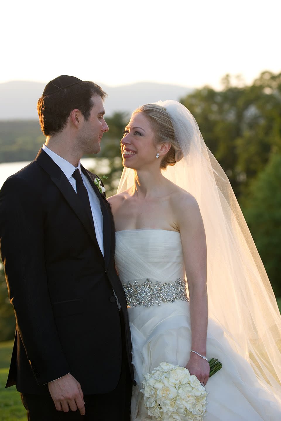 <p>Chelsea Clinton tied the knot with Marc Mezvinsky in a strapless Vera Wang gown fit for an American princess. The silver hand-embroidered crystal sash complimented the generous layers of ruffled silk organza. She wore a head-turning cathedral-length veil to walk down the aisle.</p>