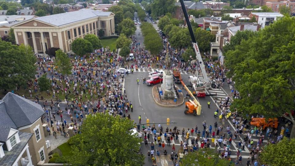 This Wednesday July 1, 2020, file photo shows workers preparing to remove the statue of Confederate General Stonewall Jackson from its pedestal on Monument Avenue in Richmond, Va. (AP Photo/Steve Helber)