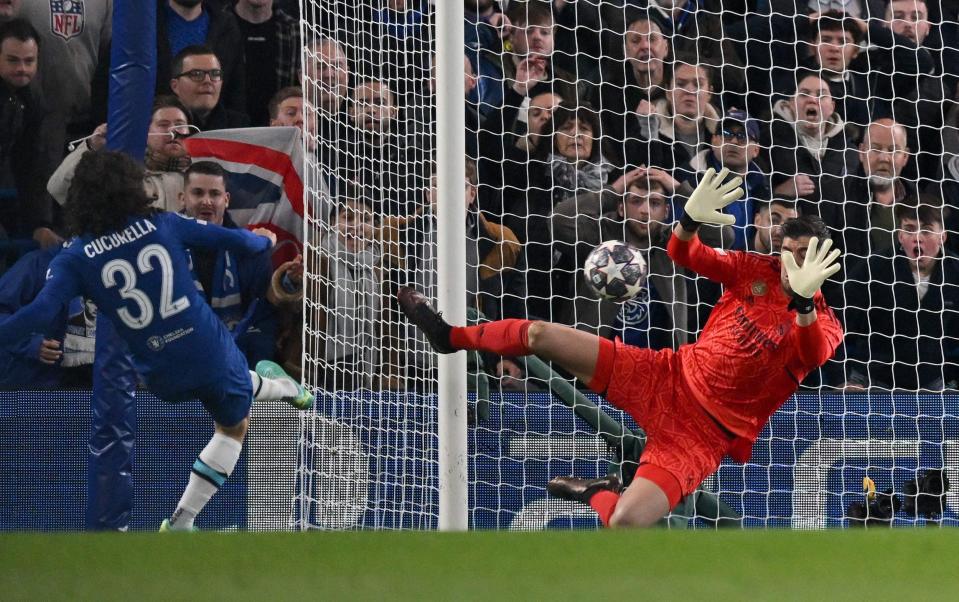 Real Madrid's Belgian goalkeeper Thibaut Courtois (R) savers a shot from Chelsea's Spanish defender Marc Cucurella - GLYN KIRK/AFP via Getty Images
