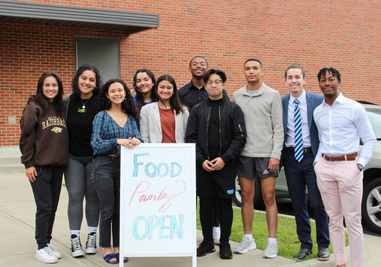 Members of IDEAL Women and Men of Excellence stand outside the Dave Stevens Lion Pride Pantry at the University of Arkansas-Fort Smith, May 6, 2022.