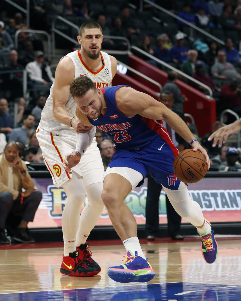 Detroit Pistons forward Blake Griffin (23) is fouled by Atlanta Hawks center Alex Len during the first half of an NBA basketball game, Friday, Nov. 22, 2019, in Detroit. (AP Photo/Carlos Osorio)