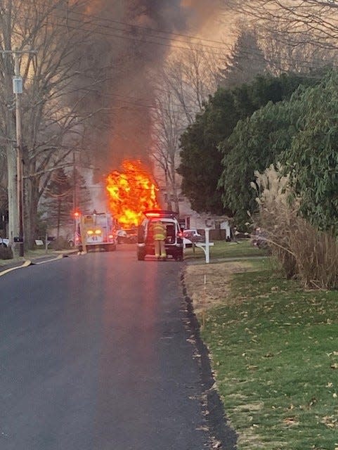 First responders work to battle a fire that ravaged a home on Cypress Place in Randolph on Saturday, Dec. 10, 2022.