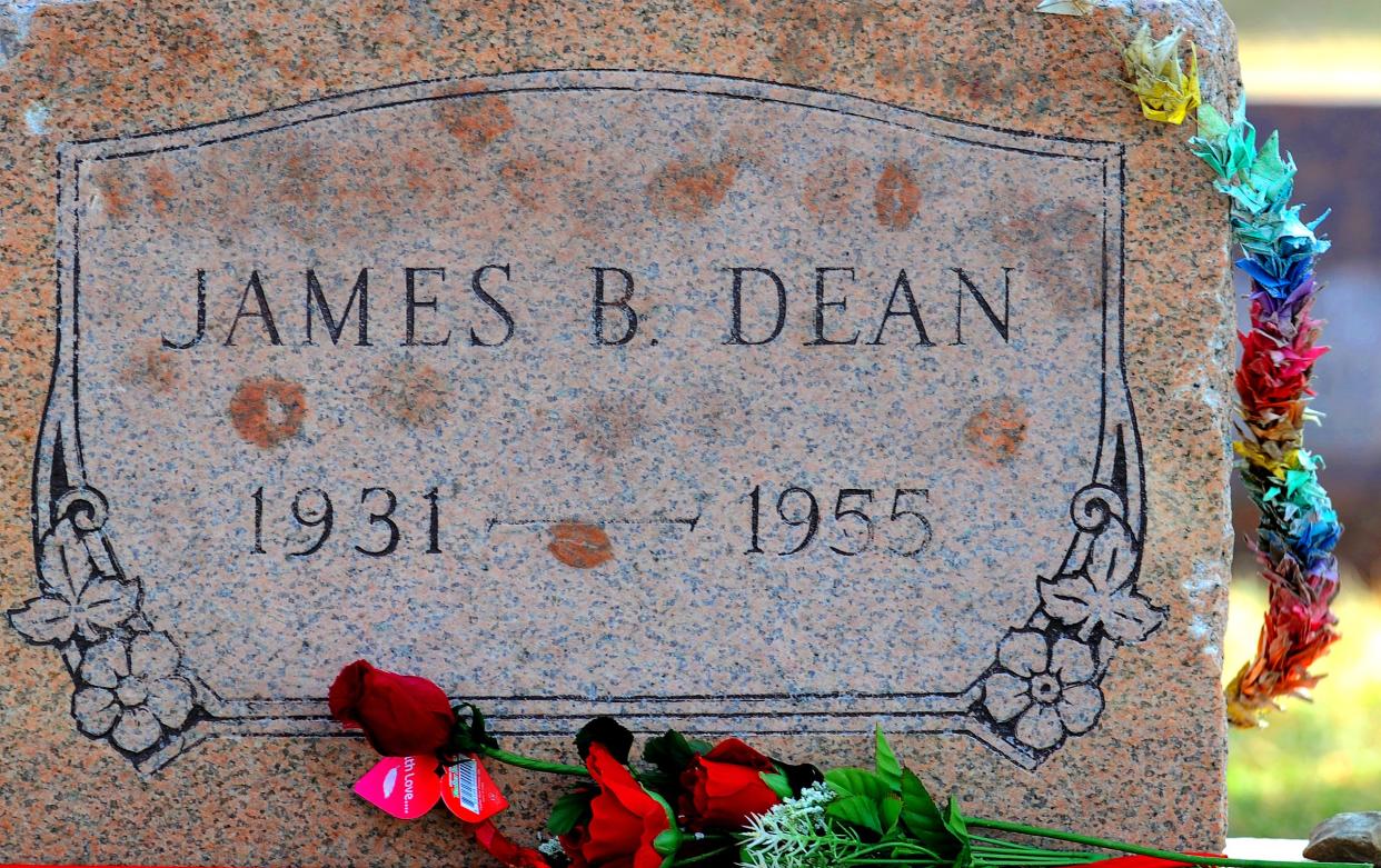 Flowers and lipstick kisses on the grave site of James Dean during the weekend celebrations of the birth of the famous hoosier movie star Sunday afternoon at Memorial Park in Fairmount IN.