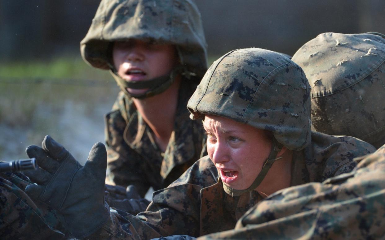 Female US Marine recruits on a training exercise - Julian Simmonds 