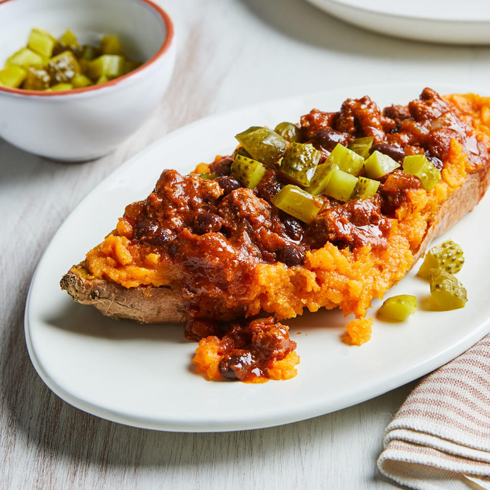 <p>Take sloppy Joes to a new level with tender sweet potatoes standing in for the bun. Sweet potatoes pair perfectly with the tangy, flavorful filling of ground beef, black beans and spices. Chopped dill pickle sprinkled on top adds crunch to this quick weeknight dinner the whole family will love. <a href="https://www.eatingwell.com/recipe/280999/sloppy-joe-stuffed-sweet-potatoes/" rel="nofollow noopener" target="_blank" data-ylk="slk:View Recipe;elm:context_link;itc:0;sec:content-canvas" class="link ">View Recipe</a></p>