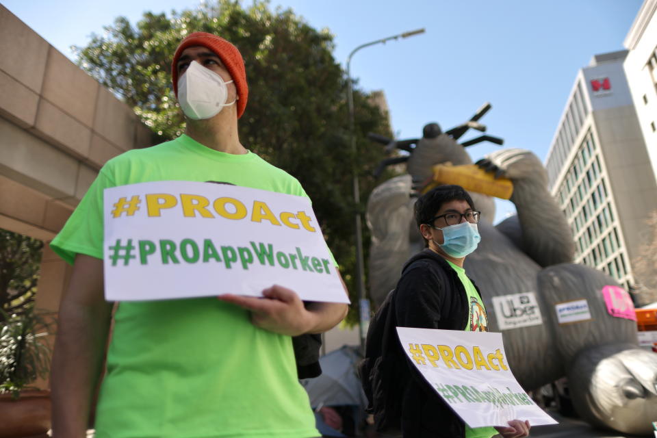 Rideshare Uber and Lyft drivers rally in support of the Protecting the Right to Organize (PRO) Act, in Los Angeles, California, U.S., March 16, 2021. REUTERS/Lucy Nicholson