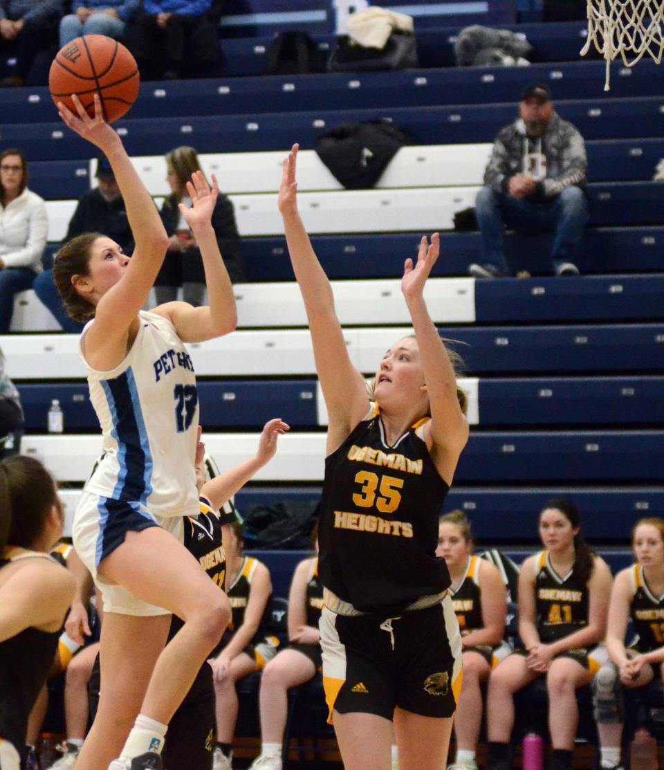 Petoskey's Caroline Guy drives through the Ogemaw Heights defense for a finish in the first half Tuesday.