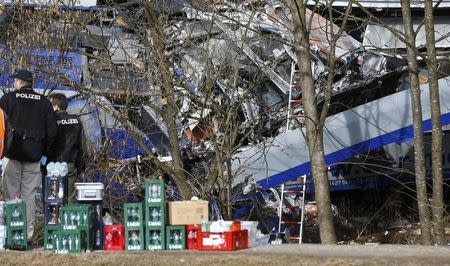 German police officers stand at the site of the two crashed trains near Bad Aibling in southwestern Germany, February 9, 2016. REUTERS/Michael Dalder