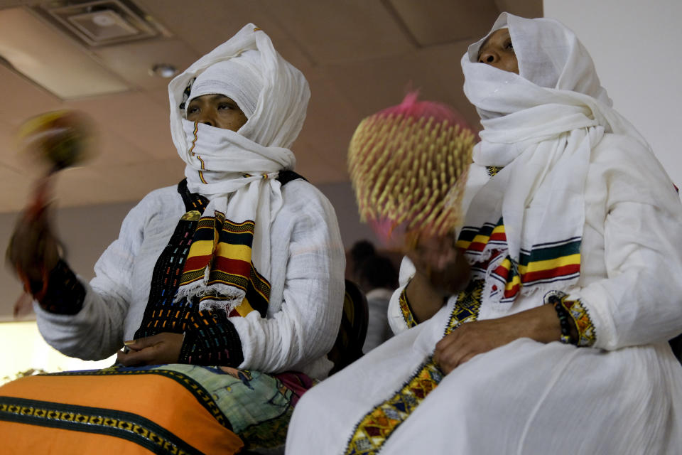 Jahdarah Mahan, left, and another member of the Rastafari community play musical instruments at an event organized by the non-profit Rastafari Coalition that marked the 91st anniversary of the coronation of the late Ethiopian Emperor Haile Selassie I on Tuesday, Nov. 2, 2021, in Columbus, Ohio. (AP Photo/Luis Andres Henao)