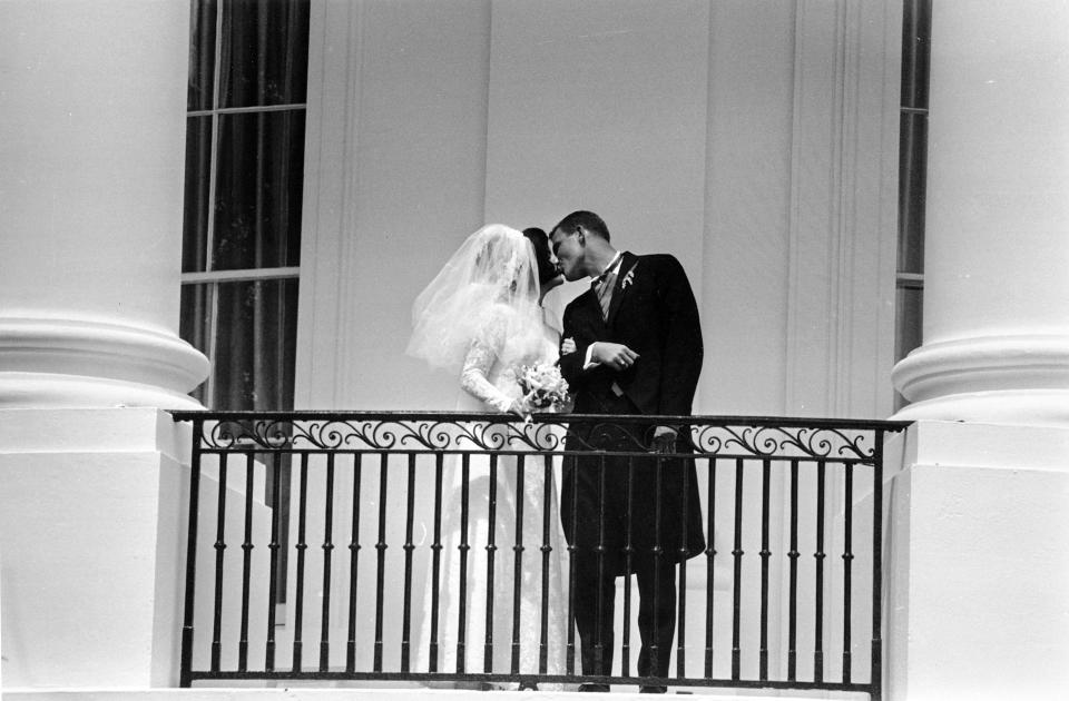 FILE - Newlyweds Luci Baines Johnson and Patrick J. Nugent as they kiss on the White House balcony in Washington, Aug. 6, 1966. (AP Photo, File)