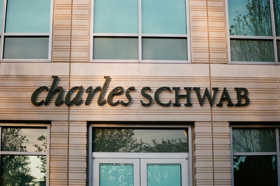 Close-up of sign with logo at Charles Schwab financial adviser branch in Pleasanton, California, March 26, 2018. (Photo by Smith Collection/Gado/Getty Images)