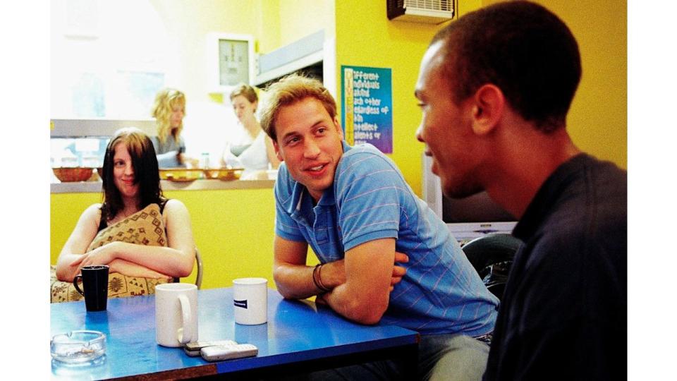 Prince William speaks to young people during a volunteering visit to homelessness charity Centrepoint in 2005