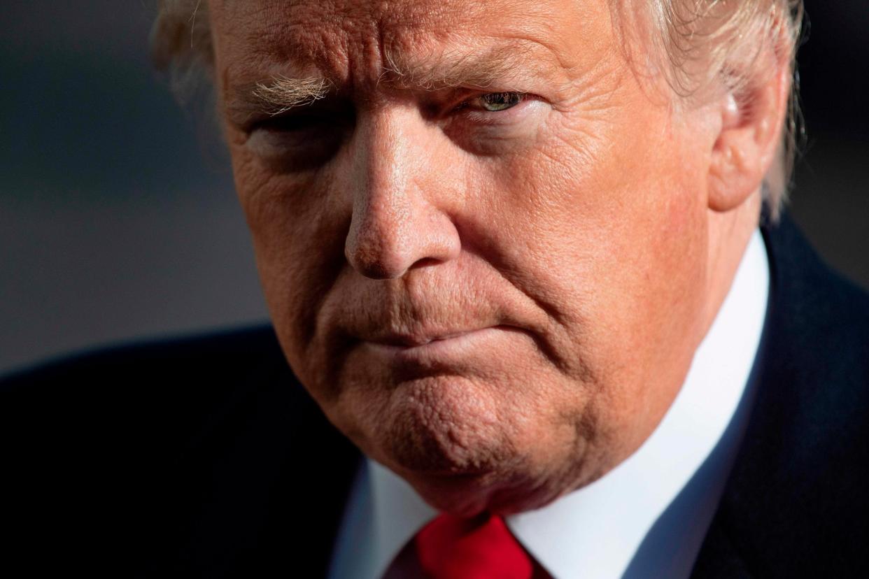 In this file photo taken on 6 January 2019 US President Donald Trump speaks as he arrives at the White House in Washington, DC, after meetings at Camp David: AFP/Getty Images