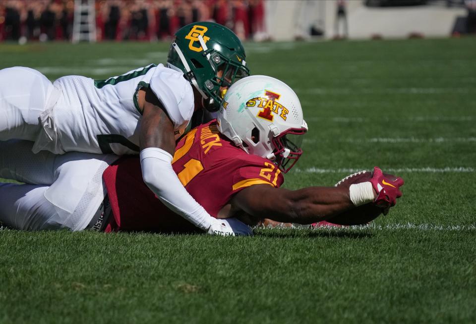Iowa State running back Jirehl Block (21) scores a touchdown in the second quarter against Baylor at Jack Trice Stadium on Saturday.