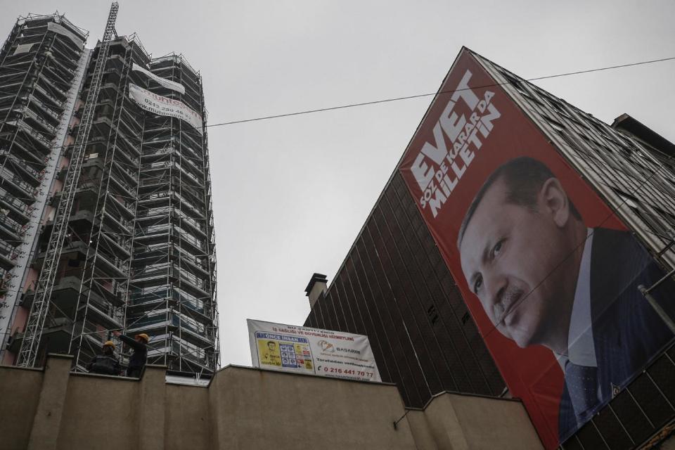 A huge poster of Turkey's President Recep Tayyip Erdogan for the upcoming April 16 referendum near the Dutch consulate in Istanbul, Saturday, March 11, 2017. Turkey and the Netherlands sharply escalated a dispute between the two NATO allies on Saturday as the Dutch withdrew landing permission for the Turkish foreign minister's aircraft, drawing Turkish President Recep Tayyip Erdogan to call them "fascists." (AP Photo/ Emrah Gurel)