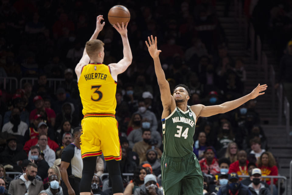 Atlanta Hawks guard Kevin Huerter (3) shoots over Milwaukee Bucks forward Giannis Antetokounmpo (34) during the first half of an NBA basketball game Monday, Jan. 17, 2022, in Atlanta. (AP Photo/Hakim Wright Sr.)