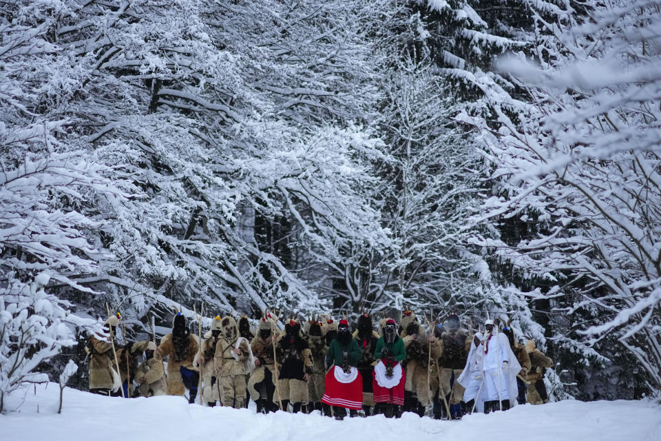 Revelers prepare for a traditional St. Nicholas procession near the village of Lidecko, Czech Republic, Sunday, Dec. 3, 2023. This pre-Christmas tradition has survived for centuries in a few villages in the eastern part of the country. (AP Photo/Petr David Josek)