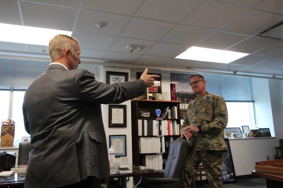 Retired Brig. Gen. Andrew Hilmes and Brig. Gen. Larry Burris, Infantry School commandant, discuss memories from the 2003 invasion of Iraq during an Army Times interview at the latter’s Fort Benning, Georgia, office on Feb. 27, 2023. The two officers were company commanders in Task Force 1-64, which led the assault into Baghdad. (Staff/Davis Winkie)