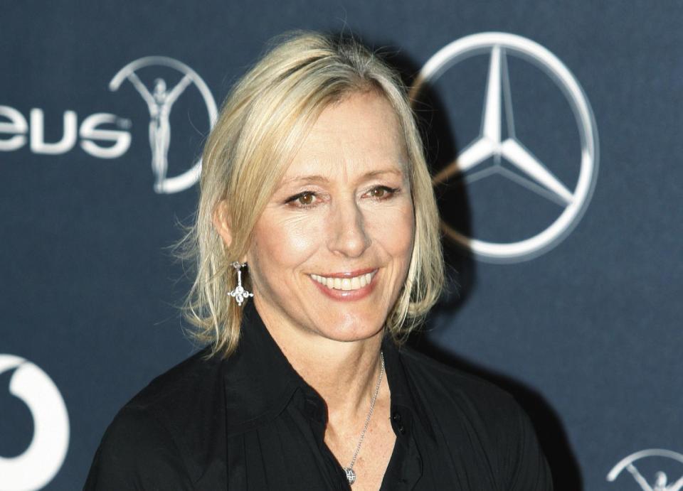 FILE - In this Feb. 6, 2012 file photo, former tennis player Martina Navratilova, arrives for the Laureus World Sports Awards in London. Navratilova will be among the 12 celebrity contestants on the next season of the ABC dancing competition, premiering March 19. (AP Photo/Lefteris Pitarakis, file)