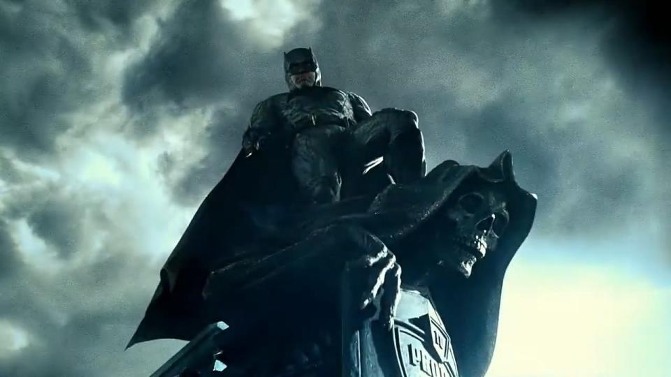 Batman standing atop a skeleton statue in "Zack Snyder's Justice League"