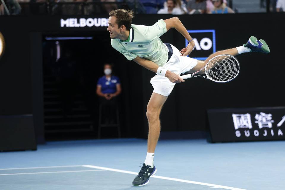 Daniil Medvedev of Russia serves to Nick Kyrgios of Australia during their second round match at the Australian Open tennis championships in Melbourne, Australia, Thursday, Jan. 20, 2022. (AP Photo/Hamish Blair)
