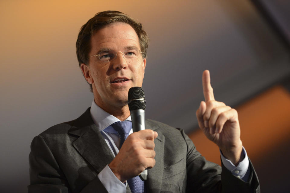 Dutch prime minister and Liberal Party leader Mark Rutte addresses supporters after exit poll results for the parliamentary elections were announced in The Hague, Netherlands, Wednesday Sept. 12, 2012. An exit poll commissioned by the two biggest Dutch news broadcasters has predicted a narrow election victory for the Prime Minister Mark Rutte's free-market VVD party. The exit poll, which will be updated with late votes, gave the VVD 41 of the House of Representatives' 150 seats and the center-left Labor Party 40 votes. The poll has a 1.5 percent margin of error, and the broadcasters said the final result was still too close to call. (AP Photo/Ermindo Armino)