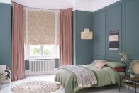 <p>Colour blocking is a playful way to break up larger bedrooms, and can be used to draw attention to interesting features or generous proportions. These fabulous blush pink Bailey Taffy Curtains at Hillarys are especially effective at drawing the eye upwards, highlighting the height of the ceiling. </p><p>Pictured: <a href="https://www.hillarys.co.uk/products/delizia-blush-roman-blind/" rel="nofollow noopener" target="_blank" data-ylk="slk:Delizia Blush Blinds" class="link ">Delizia Blush Blinds</a>, and <a href="https://www.hillarys.co.uk/products/bailey-taffy-curtains/" rel="nofollow noopener" target="_blank" data-ylk="slk:Bailey Taffy Curtains" class="link ">Bailey Taffy Curtains</a>, both at Hillarys</p>