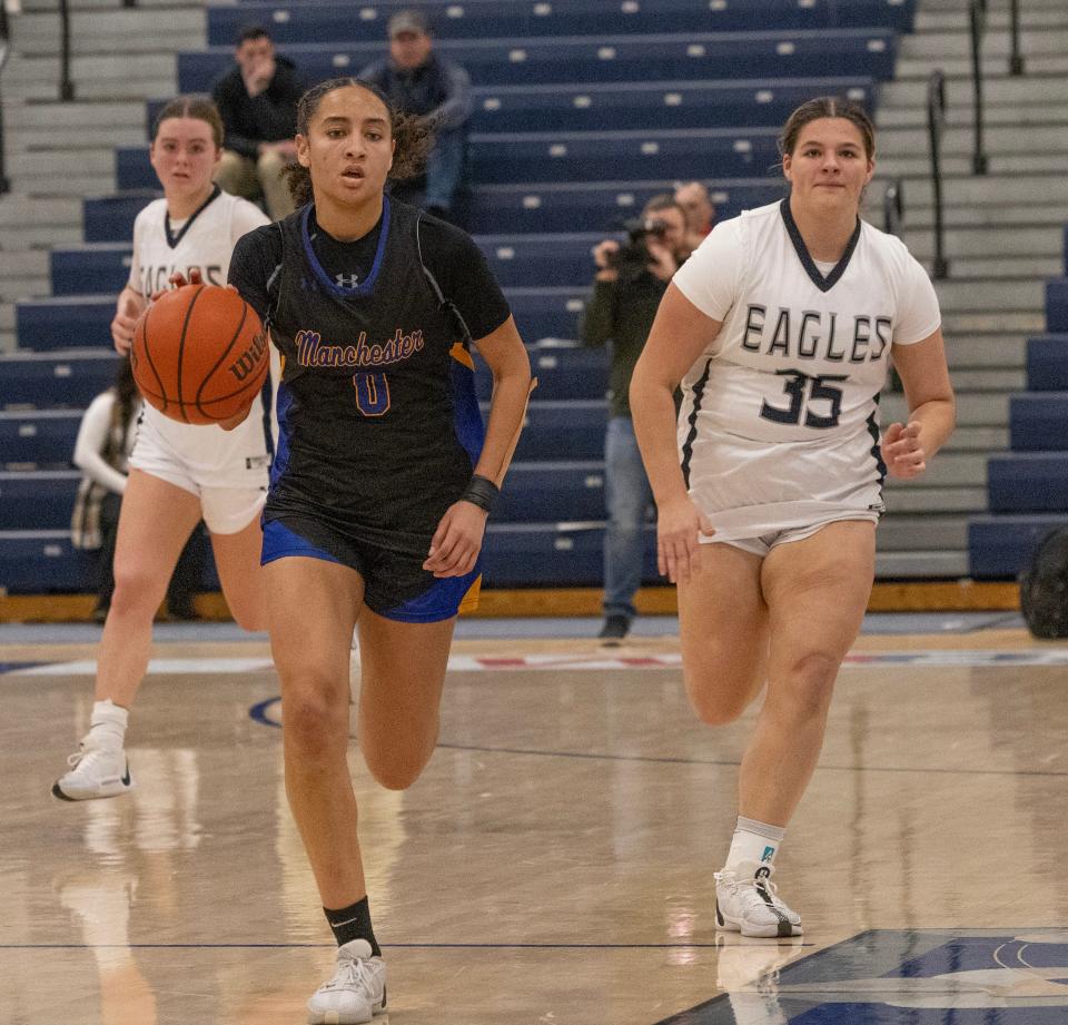 Manchester Devyn Quigley drives to the basket. Manchester Girls Basketball defeats Middletown South in 2023 WOBM Christmas Tournament opening round in Toms 
River on December 26, 2023.
