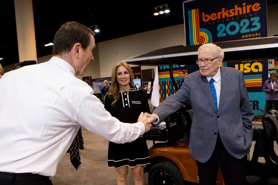 Warren Buffett greets See's Candies President and CEO Pat Egan on May 5, 2023, in Omaha, Neb.