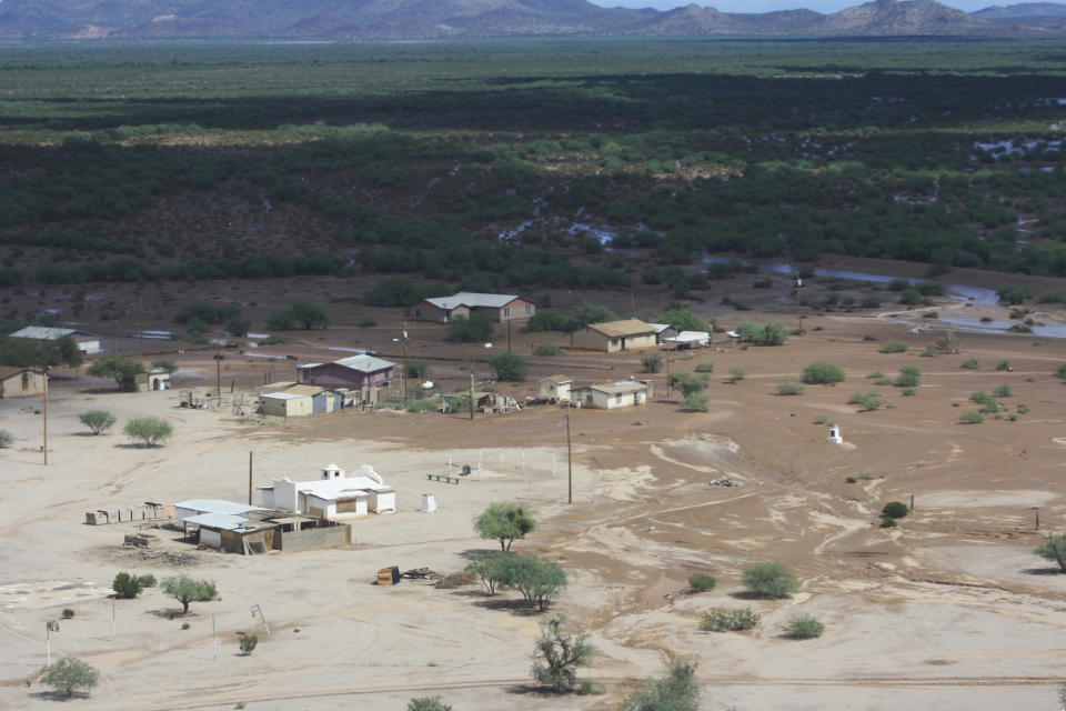 In this Oct. 3, 2018 photo, ground around Kohakt Village near Pinal County, Ariz., is saturated by floodwater. The Tohono O'odham Nation says more than 30 residents from Kohakt were evacuated because of flooding. (Richard Saunders/Tohono O'odham Nation Department of Public Safety via AP)