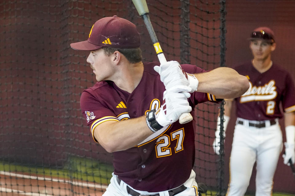 Arizona State University NCAA college baseball player Brandon Compton takes batting practice before their game against Oregon in Phoenix, Saturday, March 9, 2024. Most teenagers celebrate their high school graduation with friends, family and maybe a party. Brandon Compton had Tommy John surgery.(AP Photo/Darryl Webb)