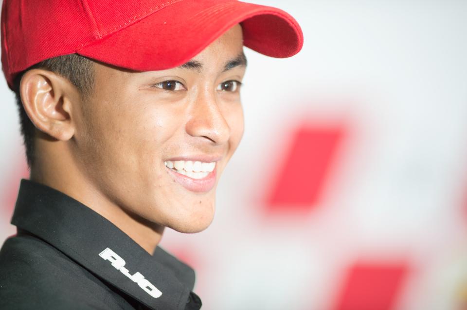 KUALA LUMPUR, MALAYSIA - OCTOBER 20: Muhammad Zulfahmi Khairuddin of Malaysia and Air Asia-SIC-Ajo poses and celebrates his first Pole Position in Moto3 during the press conference at the end of the qualifying practice of the MotoGP Of Malaysia at Sepang Circuit on October 20, 2012 in Kuala Lumpur, Malaysia. (Photo by Mirco Lazzari gp/Getty Images)