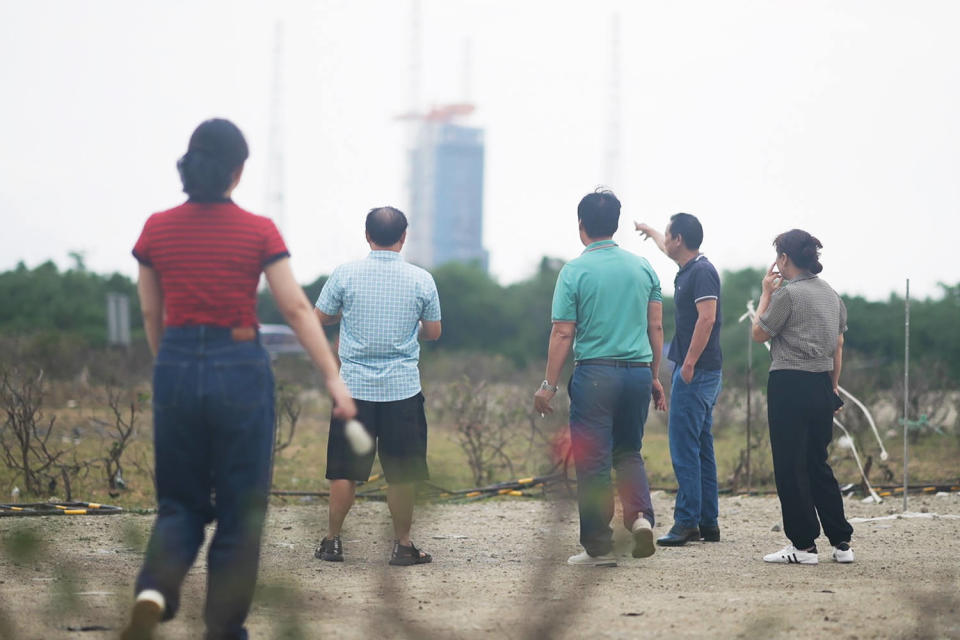 Space enthusiasts await the launch of China’s Chang’e 6 lunar probe on the island of Hainan on Thursday. (Fred Dufour / NBC News)
