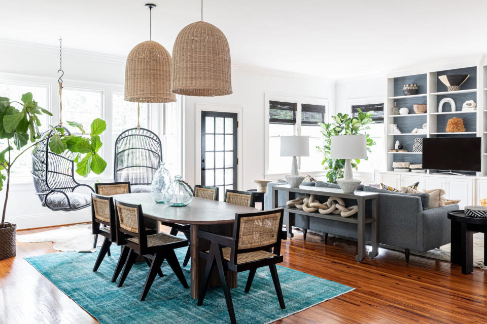 a living room and dining room with a front door