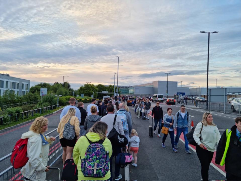 Passengers queue outside Bristol Airport at 5am on Monday morning  (Twitter/@paulwtrueman)