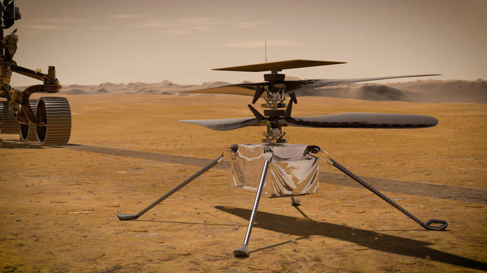UNSPECIFIED: In this concept illustration provided by NASA, NASA's Ingenuity Mars Helicopter stands on the Red Planet's surface as NASA's Mars 2020 Perseverance rover (partially visible on the left) rolls away. NASA's Perseverance (Mars 2020) rover will store rock and soil samples in sealed tubes on the planet's surface for future missions to retrieve in the area known as Jezero crater on the planet Mars. A key objective for Perseverance's mission on Mars is astrobiology, including the search for signs of ancient microbial life. The rover will characterize the planet's geology and past climate, paving the way for human exploration of the Red Planet, and be the first mission to collect and cache Martian rock and regolith. (Photo illustration by NASA via Getty Images)