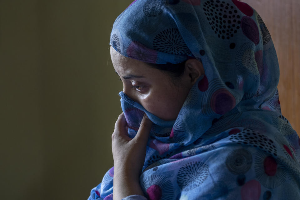 Sehrish Bhat, pregnant wife of an Indian army solider Waseem Sarvar Bhat, who was killed in a gunfight with suspected rebels, grieves at her residence in Bandipora, north of Srinagar, Indian controlled Kashmir, Saturday, Aug. 5, 2023. Three Indian soldiers were killed in a gunbattle with rebels fighting against New Delhi's rule in Kashmir, officials said Saturday, as authorities stepped up security on the fourth anniversary since India revoked the disputed region's special status.(AP Photo/Dar Yasin)