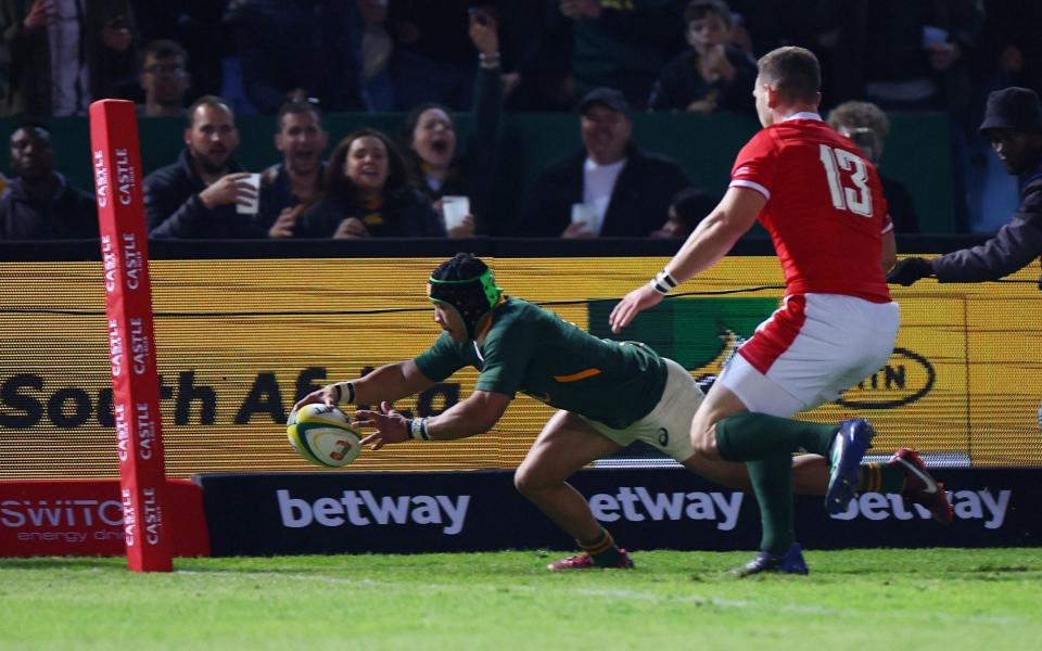 Cheslin Kolbe dots down in the corner - REUTERS