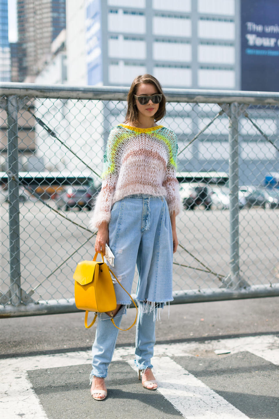 A bright yellow backpack spotted at New York Fashion Week.