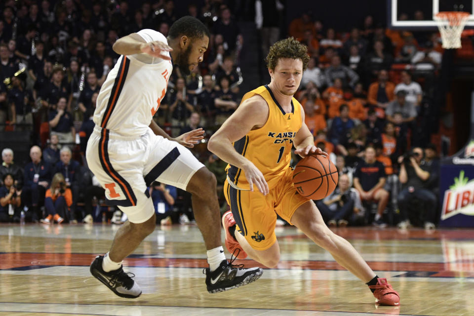 Kansas City's Sam Martin (1) works the ball against Illinois' Jayden Epps during the second half of an NCAA college basketball game Friday, Nov. 11, 2022, in Champaign, Ill. (AP Photo/Michael Allio)