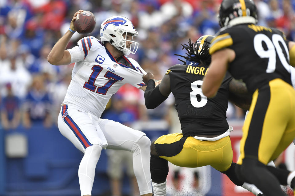 Buffalo Bills quarterback Josh Allen (17) is pressured by Pittsburgh Steelers linebacker Melvin Ingram (8) during the first half of an NFL football game in Orchard Park, N.Y., Sunday, Sept. 12, 2021. (AP Photo/Adrian Kraus)